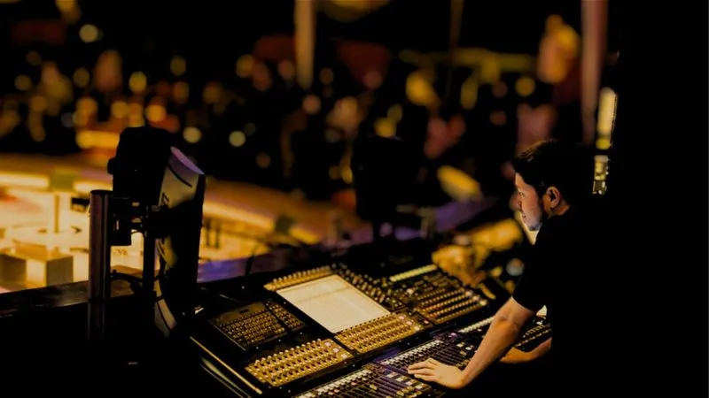 Sound engineer at mixing desk